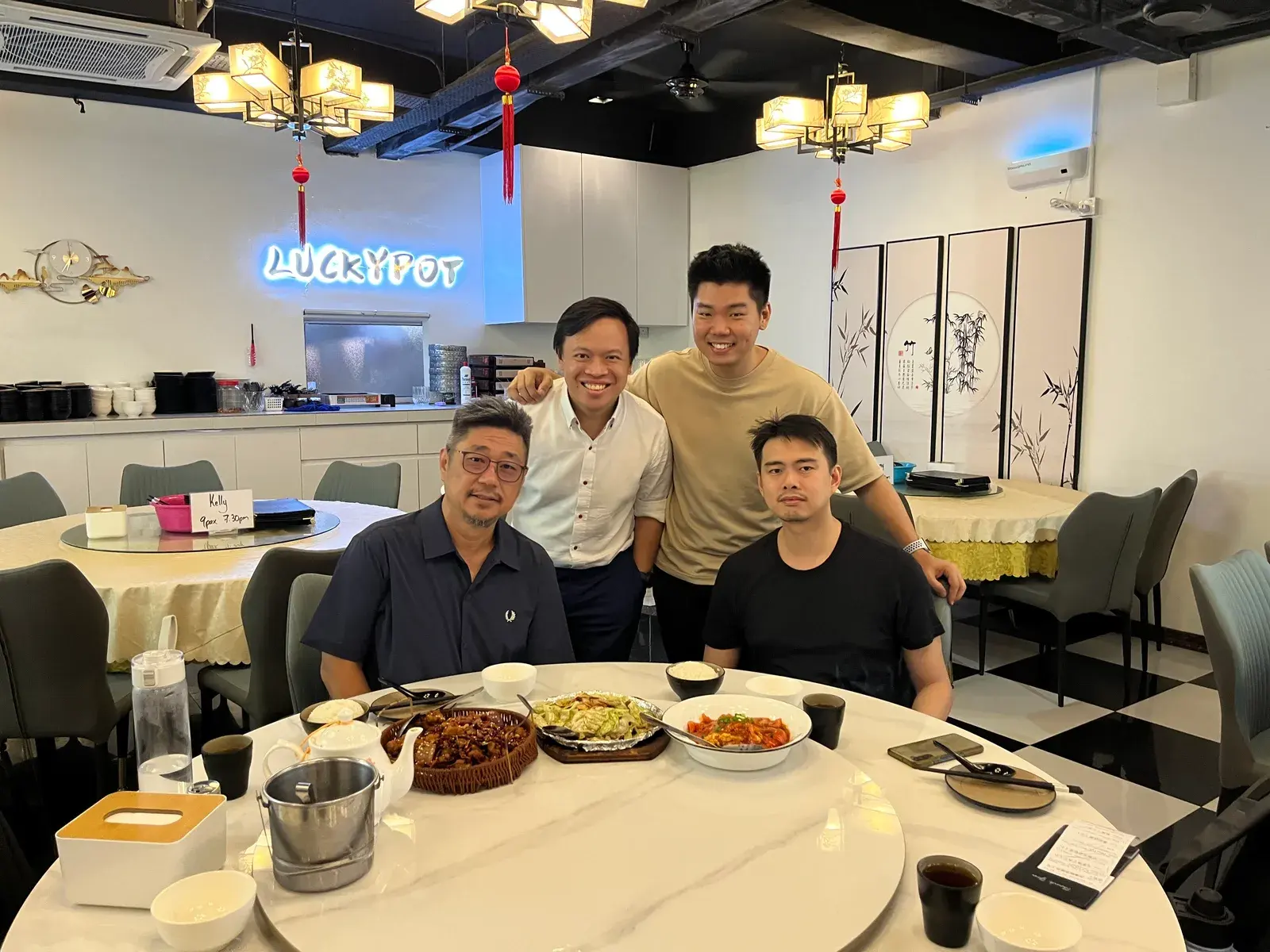 Adrian Ching at dinner with a group